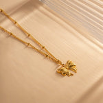 June Schleifenhalskette in Gold